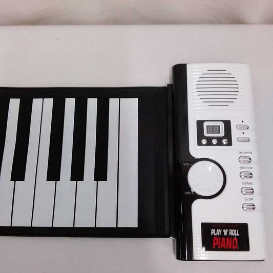 SHARPER IMAGE ROLL N PLAY PIANO WITH BAG AND CHARGER (DONATED DOESNT FULLY WORK)